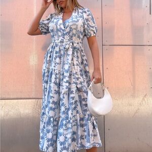 Black and white daisy print wrap dress. Midi length